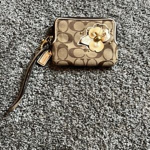 Coach, beige wristlet, with flower